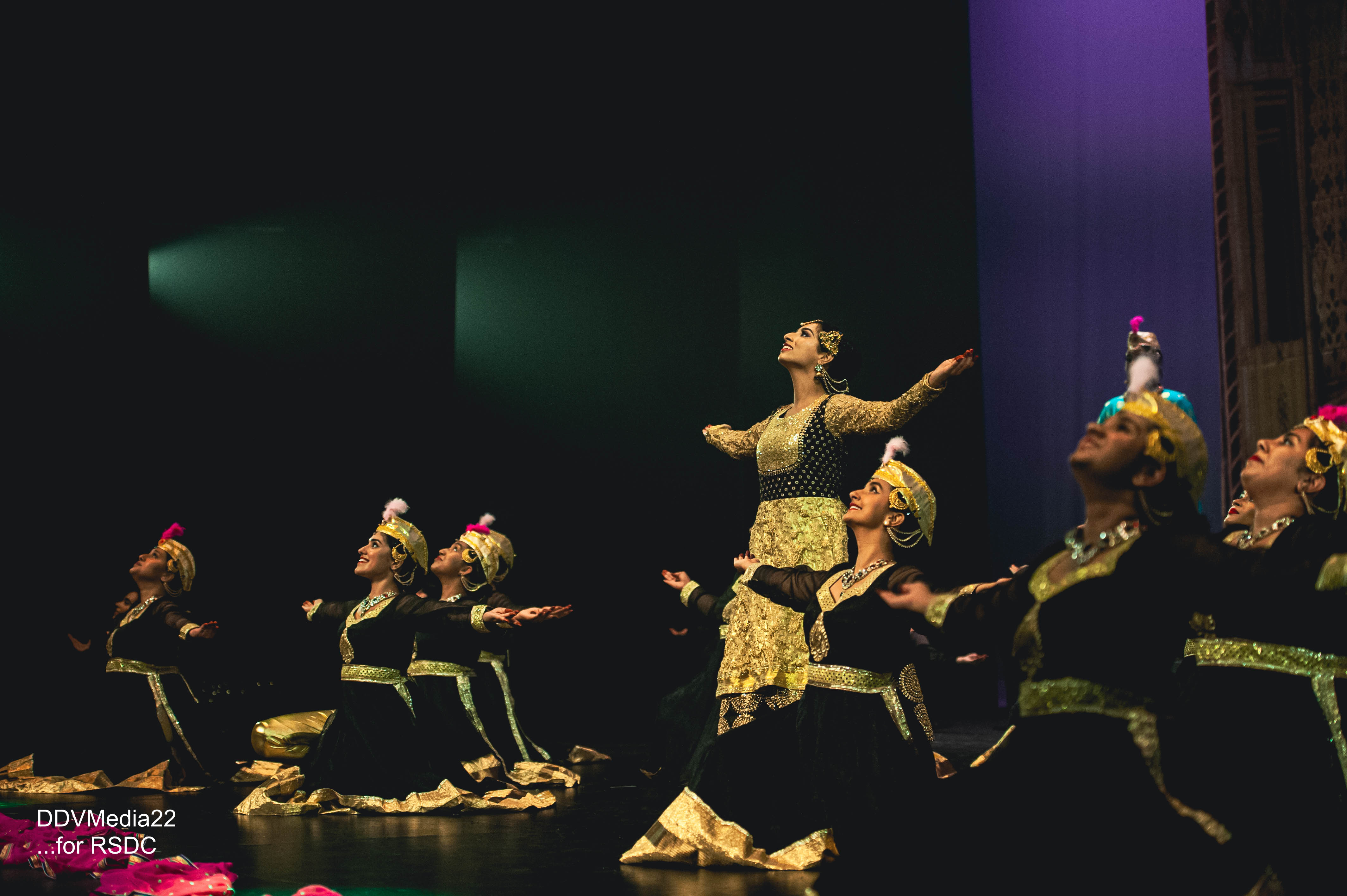 Ruchi Sanghi Dance Company Banner dancers finishing pose on stage